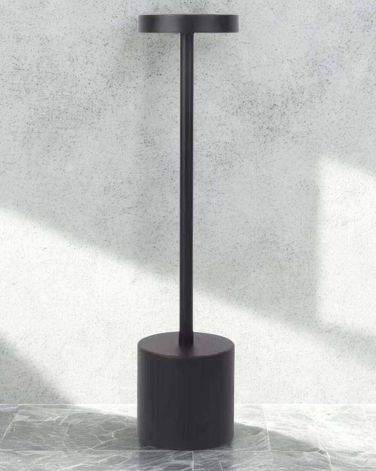 Minimalist black LumiHikari Scandinavian Lamp with sleek metal design and touch-activated top switch.