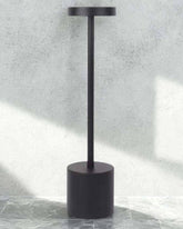 Minimalist black LumiHikari Scandinavian Lamp with sleek metal design and touch-activated top switch.