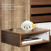 Spotted Puppy Night Light on wooden bedside table in bedroom setting
