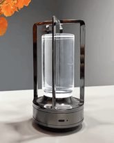 LumiHikari Crystal Lantern Lamp with faceted crystal body and sleek black metal frame, emitting soft glow.